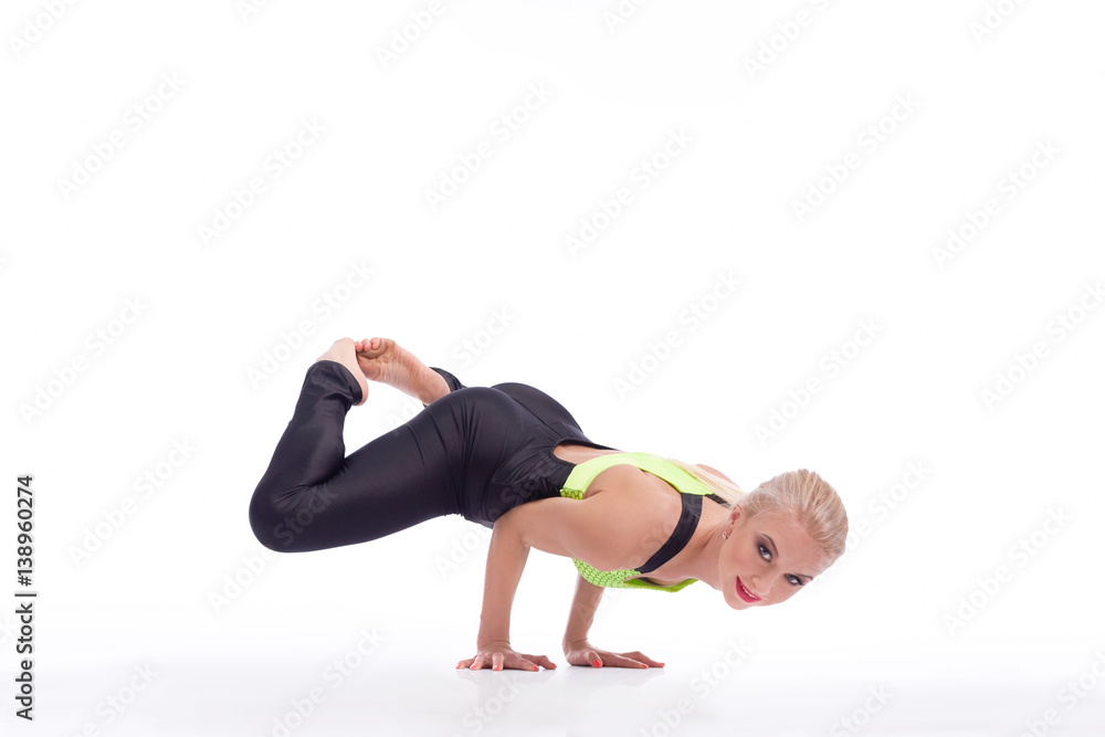 Attractive female gymnast exercising at studio Attractive female gymnast exercising at studio