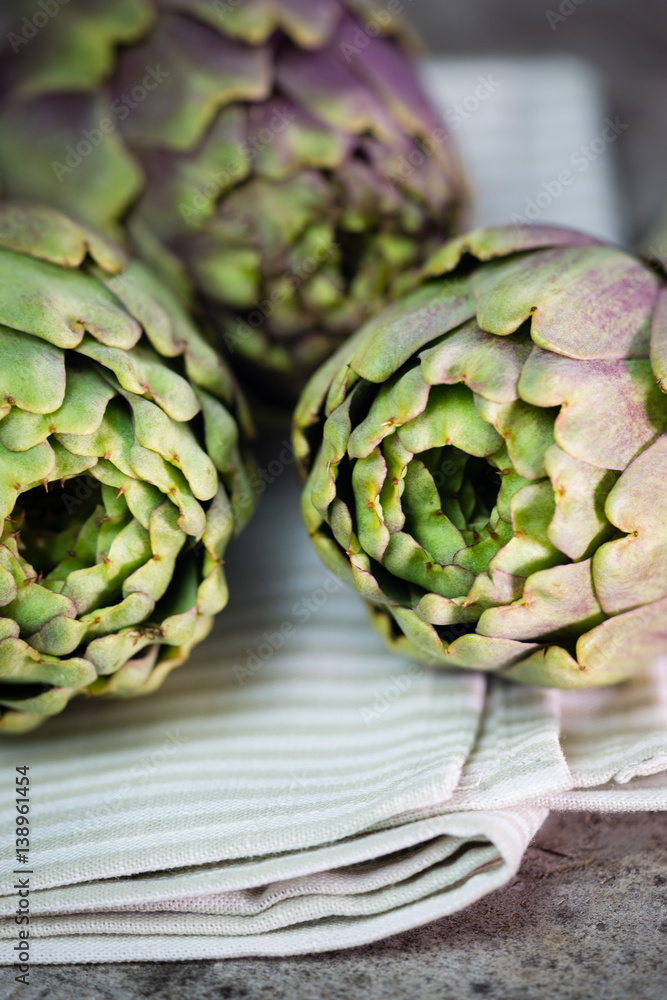 Fototapeta premium artichokes on wooden board