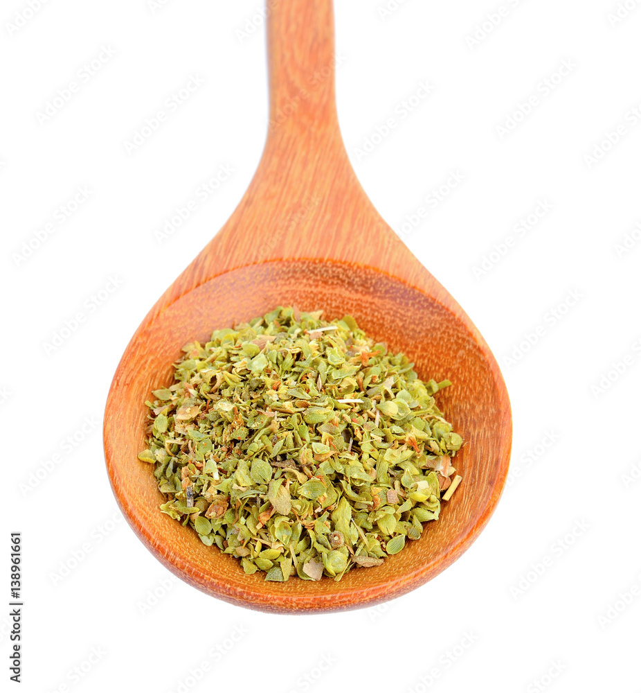 Dried Oregano in wood spoon on white background Dried Oregano in wood spoon on white background