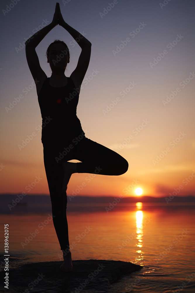 Woman doing advanced balancing yoga pose in park - a Royalty Free Stock  Photo from Photocase