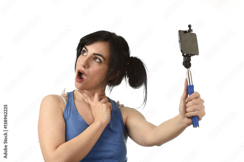 sexy woman taking selfie photo with stick and mobile phone camera posing happy sexy woman taking selfie photo with stick and mobile phone camera posing happy