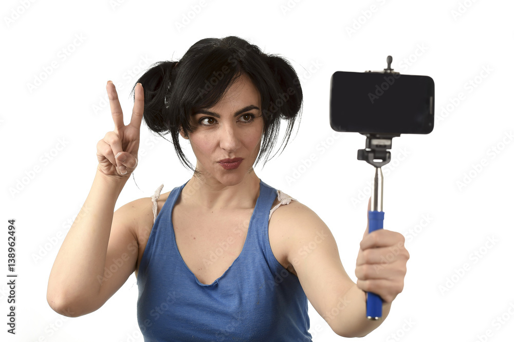sexy woman taking selfie photo with stick and mobile phone camera posing happy sexy woman taking selfie photo with stick and mobile phone camera posing happy