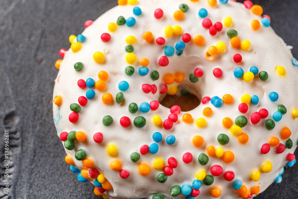 Donuts glazed with various sprinkles Donuts glazed with various sprinkles