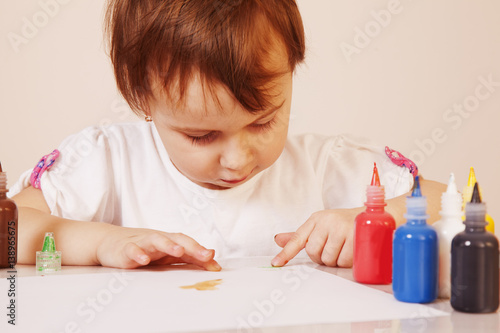 great artist (humorous picture) beautiful little baby girl draws a picture paints (postmodernism, talent, creativity, creativity)