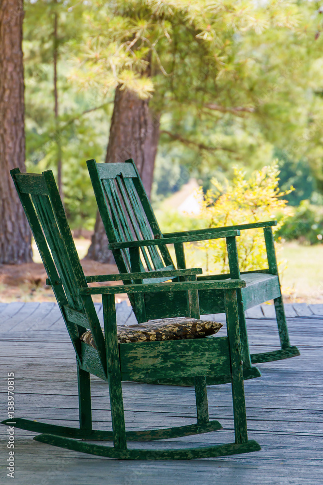 Two empty rocking chairs on a porch in the afternoon Two empty rocking chairs on a porch in the afternoon