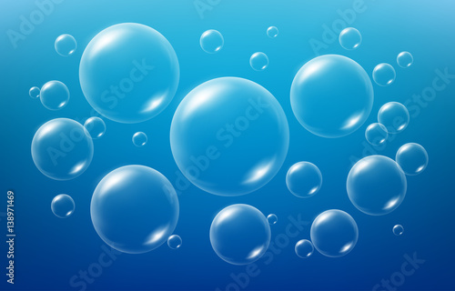 Soap bubbles on blue background