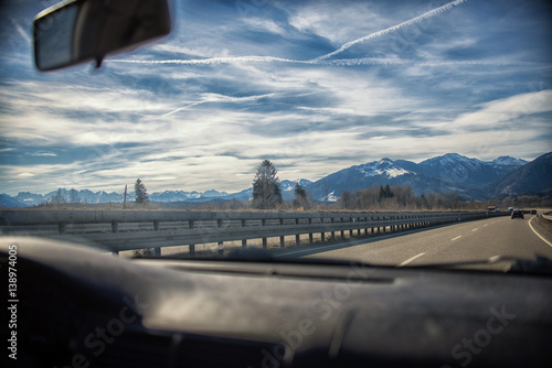 highway in the Alps. view from inside car,