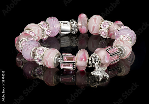 Foto Fashion jewelry bangle beads background black