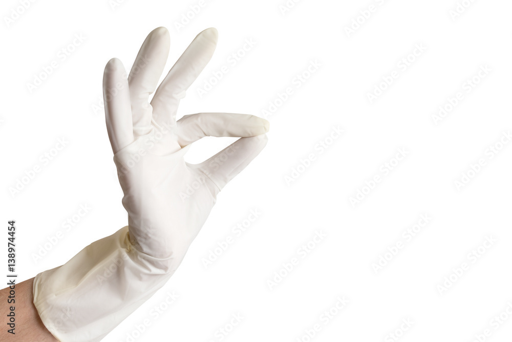 Hand wearing white rubber glove making a gesture okay. Hand wearing white rubber glove making a gesture okay.