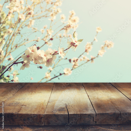 Fototapeta Naklejka Na Ścianę i Meble -  wooden table in front of spring cherry tree