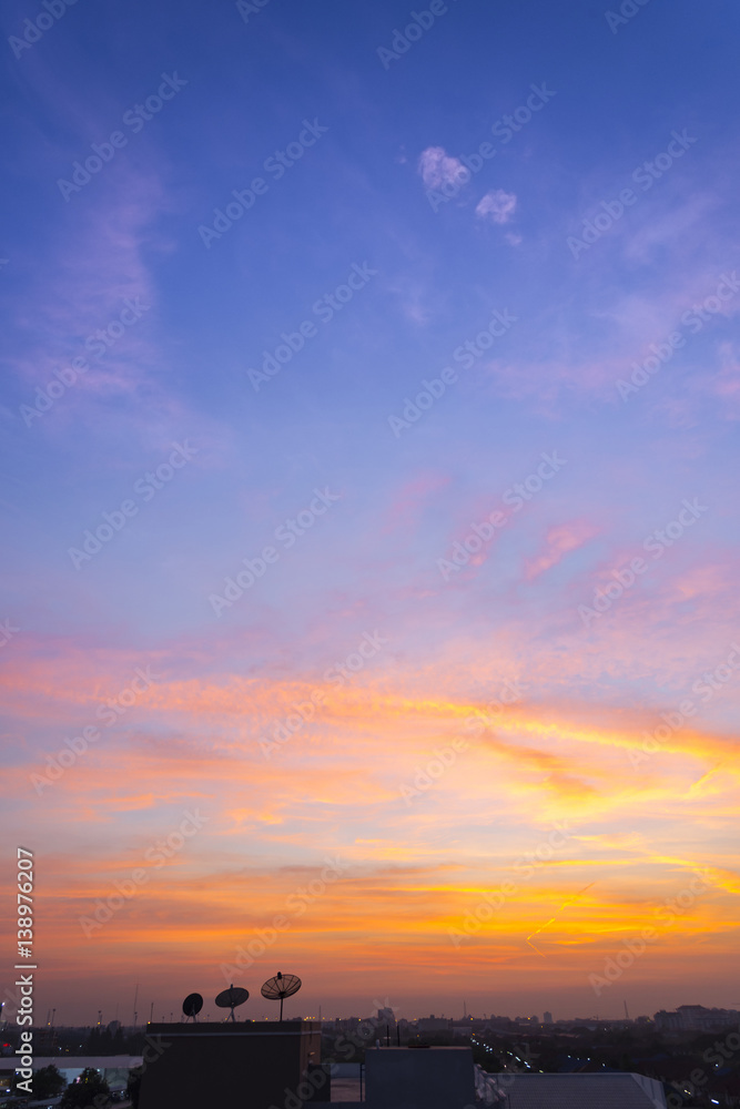 sunset sky with rays of light shining clouds and sky background and texture