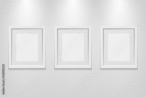 Empty picture frames on the wall with light effect, vector illustration
