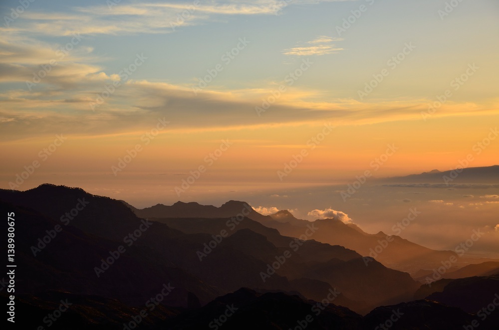 Silhouettes of mountains at sunset, from summit of Gran canaria, Canary islands