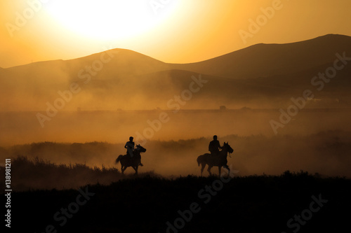 Wallpaper Mural Two men running horses silhouette Torontodigital.ca