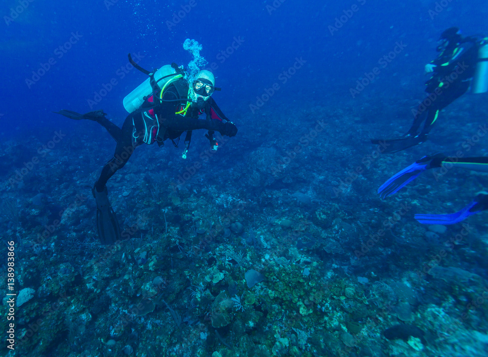 Underwater scene with scuba diver in the Caribbean sea