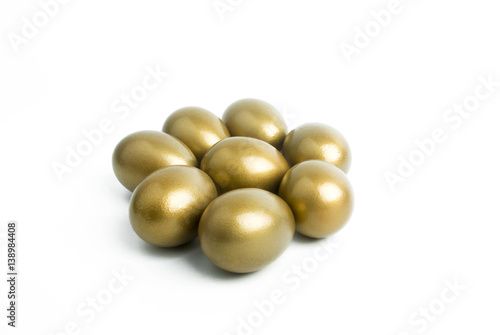white isolated and gold eggs