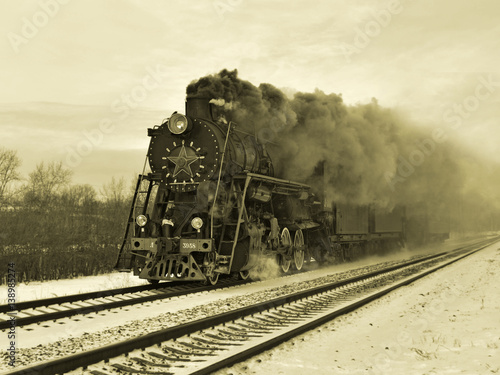 steam engine and carriages in full steam