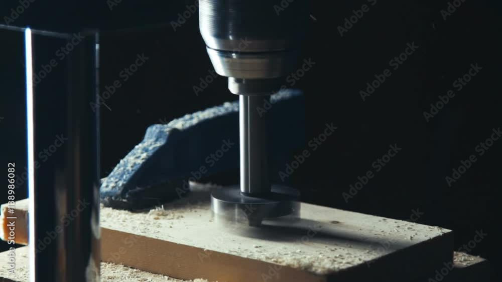Slowmotion. Man with electric jigsaw cutting a piece of wood. Close up. Slow motion. Tools for processing of wood and manufacture of wood products. Making The hole in the wooden Slowmotion. Man with electric jigsaw cutting a piece of wood. Close up. Slow motion. Tools for processing of wood and manufacture of wood products. Making The hole in the wooden