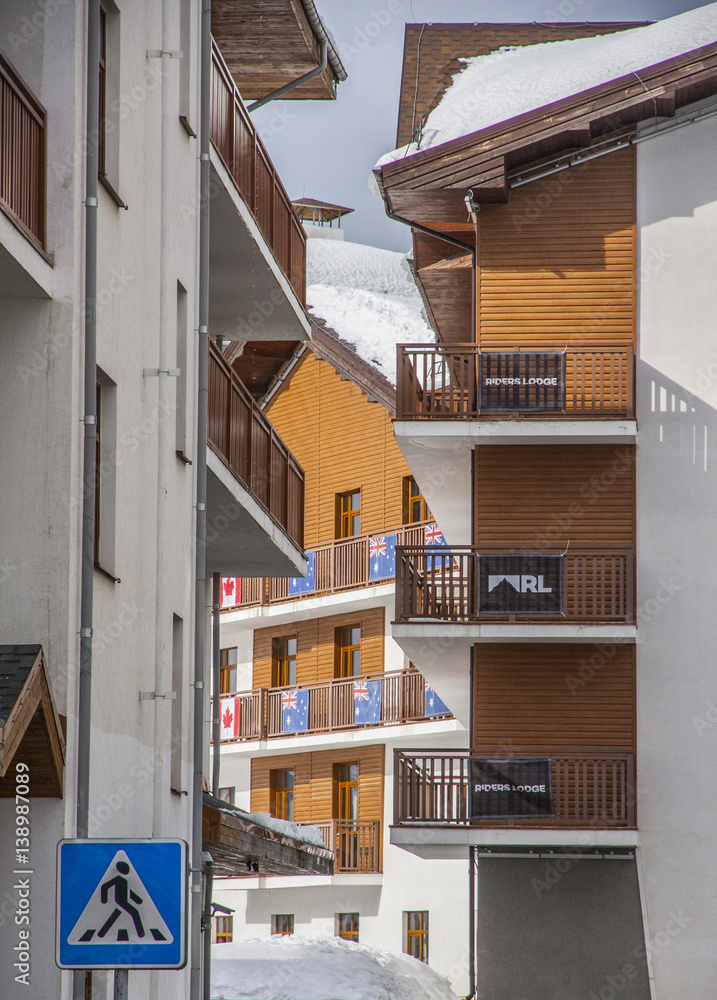 Sochi Rosa Khutor Hotels in the snowy mountains, snowboarders and skiers, January 2017