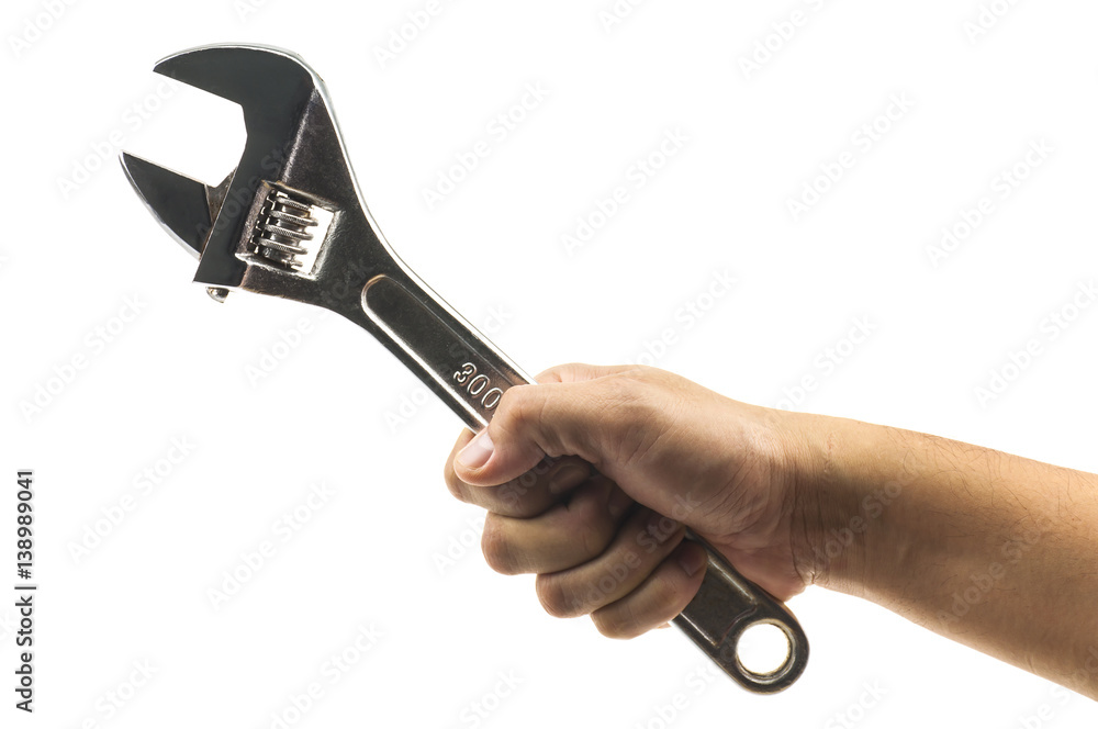 Man's hand holding big wrench isolated over white. Photo includes clipping path Man's hand holding big wrench isolated over white. Photo includes clipping path
