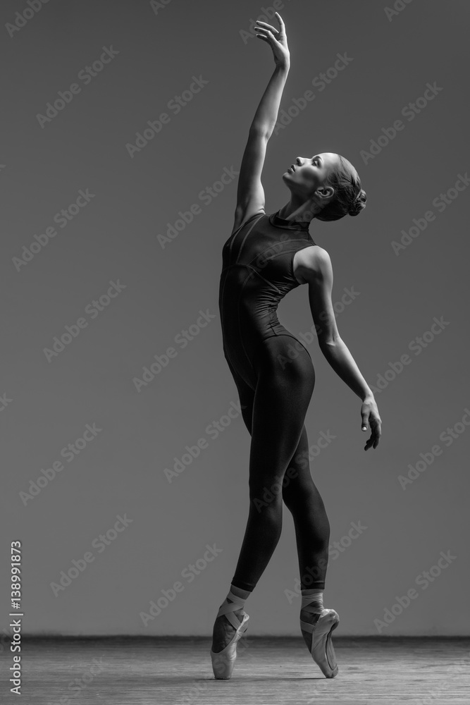 Young beautiful dancer posing in studio