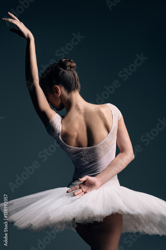 Obraz na plátně Young beautiful dancer posing in studio