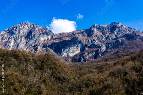 Mountains and cliffs during winter in Valtellina, Italy