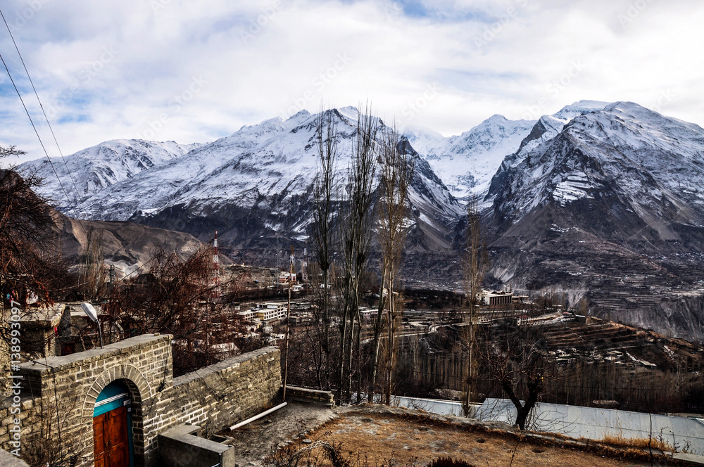 Fototapeta premium A village among the high mountains and peaks