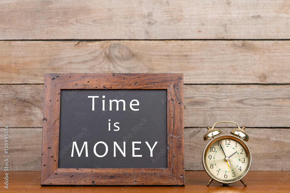 Alarm clock and blackboard with text Alarm clock and blackboard with text