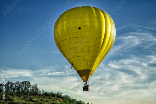 Start of big hot air balloons at the field with cool cloudy sky