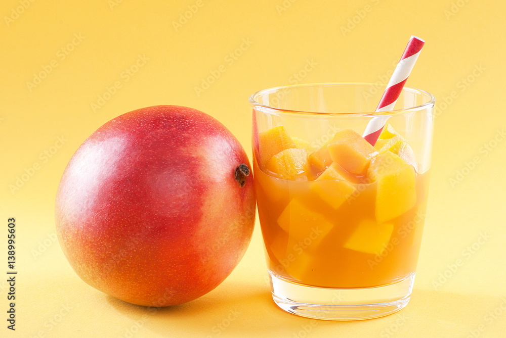 cubes of mango pulp isolated on a yellow background cubes of mango pulp isolated on a yellow background