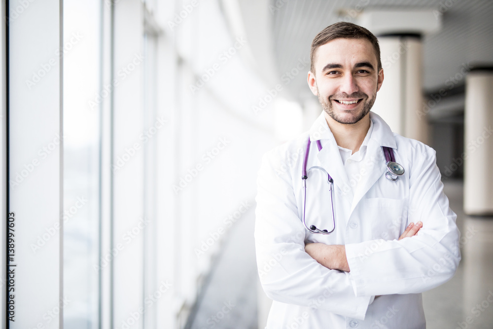 Portrait of attractive young doctor in clinic hall Portrait of attractive young doctor in clinic hall