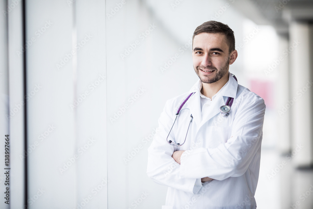 Portrait of attractive young doctor in clinic hall Portrait of attractive young doctor in clinic hall
