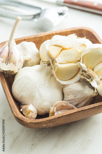 Fresh garlic in wooden bowl.