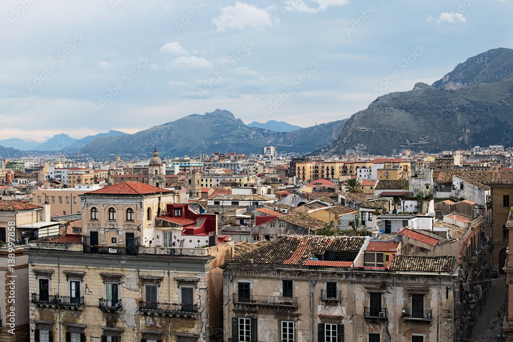From the roof of Palermo Cathedral you can see amazing cityscape of Palermo. Beautiful tiled roofs of old houses. Nice mountain in the background. Palermo. Sicily