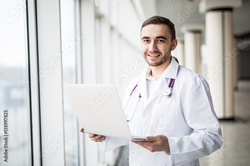attractive young medical worker using laptop