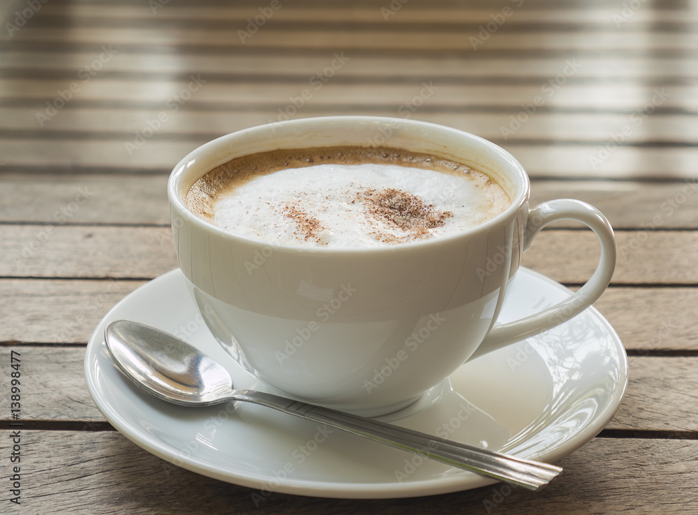 Coffee cup over brown plank wood table Coffee cup over brown plank wood table