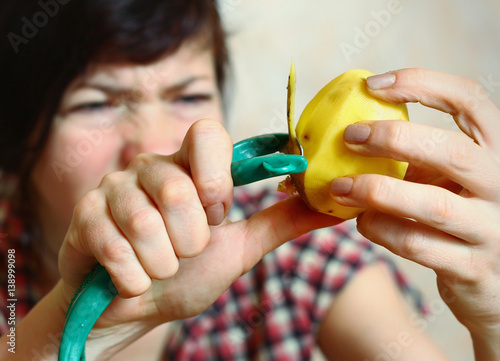 houswife try to peel potato vegetable cutter photo