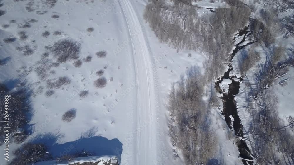 Aerial descent winter snow mountain creek. Winter snow on landscape of central Utah. Cold season weather. Nature and environment. Beautiful natural environment. Drone flight. Aerial descent winter snow mountain creek. Winter snow on landscape of central Utah. Cold season weather. Nature and environment. Beautiful natural environment. Drone flight.