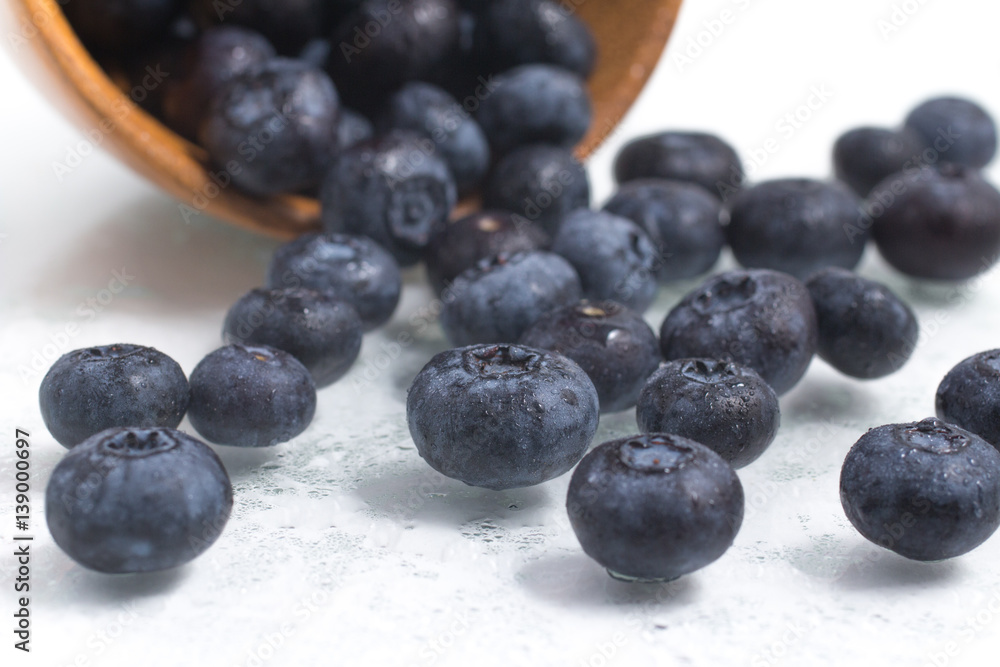 Fresh wet Blueberries into a bowl Fresh wet Blueberries into a bowl