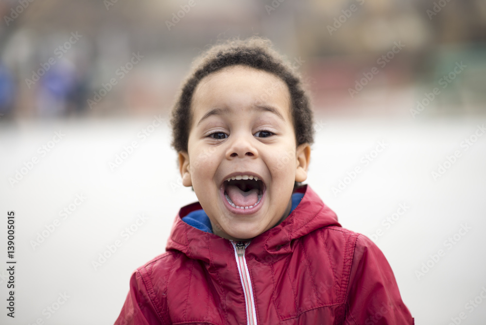 portrait of a beautiful multi racial boy with a huge smile portrait of a beautiful multi racial boy with a huge smile