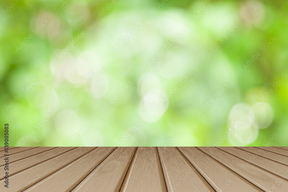 Wooden board empty table Perspective brown wood table over blurred trees with bokeh background - can be used mock up for display or montage your products. spring season. Wooden board empty table Perspective brown wood table over blurred trees with bokeh background - can be used mock up for display or montage your products. spring season.