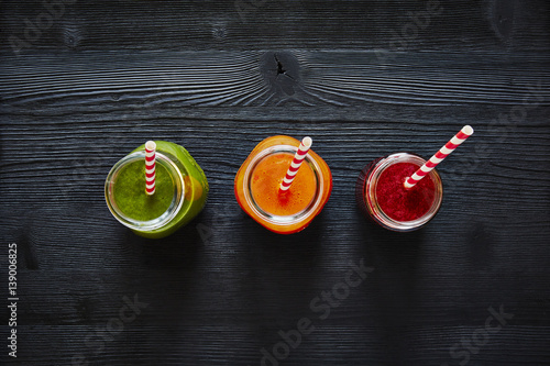 three colorful smoothies graphic view green red orange