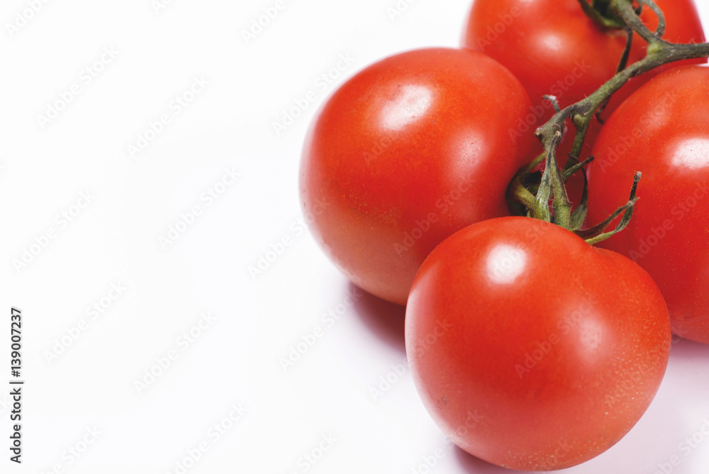 Close-up of tomatoes on white background. Copy-space. Close-up of tomatoes on white background. Copy-space.