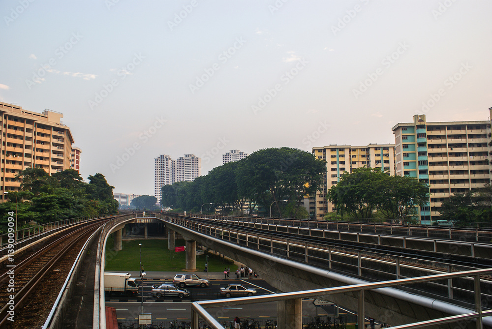 Singapore. MRT Train Tracks near Ang Mo Kio Station. Аpartment buildings in the background.