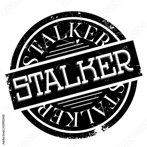 Stalker rubber stamp. Grunge design with dust scratches. Effects can be easily removed for a clean, crisp look. Color is easily changed. photo