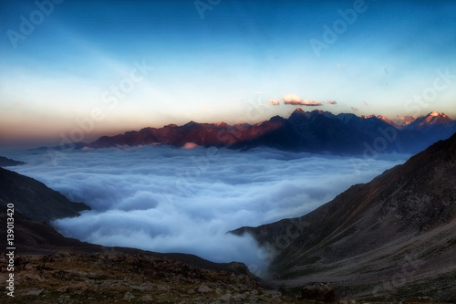 Best mountains sunset landscape. Colorful cloud sunset in Caucasus mountains