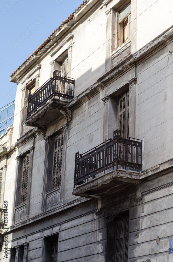 New classic house in athens first floor with crafted iron handrails, marble balconies, wooden windows viewing angle