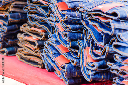 heap of jeans on sale in Thailand market.