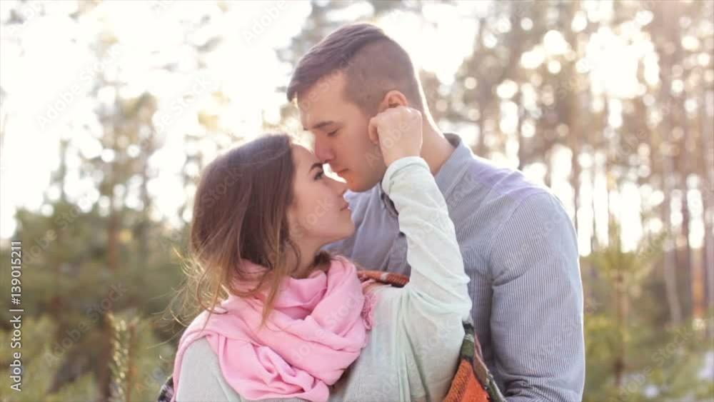 Man gently hug the girl's shoulders in the open air in the forest.Full hd video. Man gently hug the girl's shoulders in the open air in the forest.Full hd video.